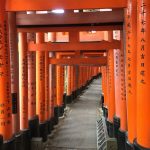 many red torii at small shrine at Fushimi Inari Shrine